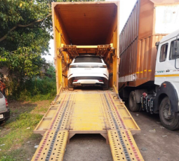 Car being loaded onto a carrier ramp
