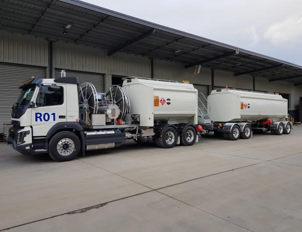 Crane and earthmoving equipment on a trailer