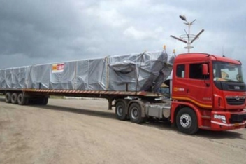Large boiler vessel loaded for road transport