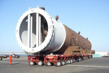 Large boiler vessel loaded for road transport